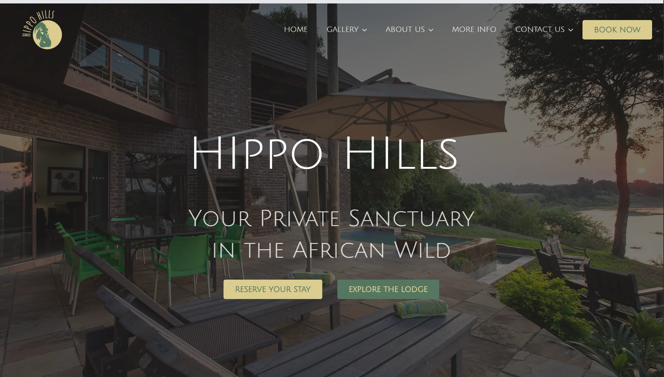 Hippo Hills Lodge website homepage, showing the lodge terrace overlooking the river at dusk